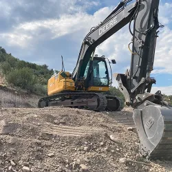 An excavator preparing a construction site